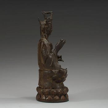 A bronze figure of Guanyin, Ming dynasty with archaistic characters to back.