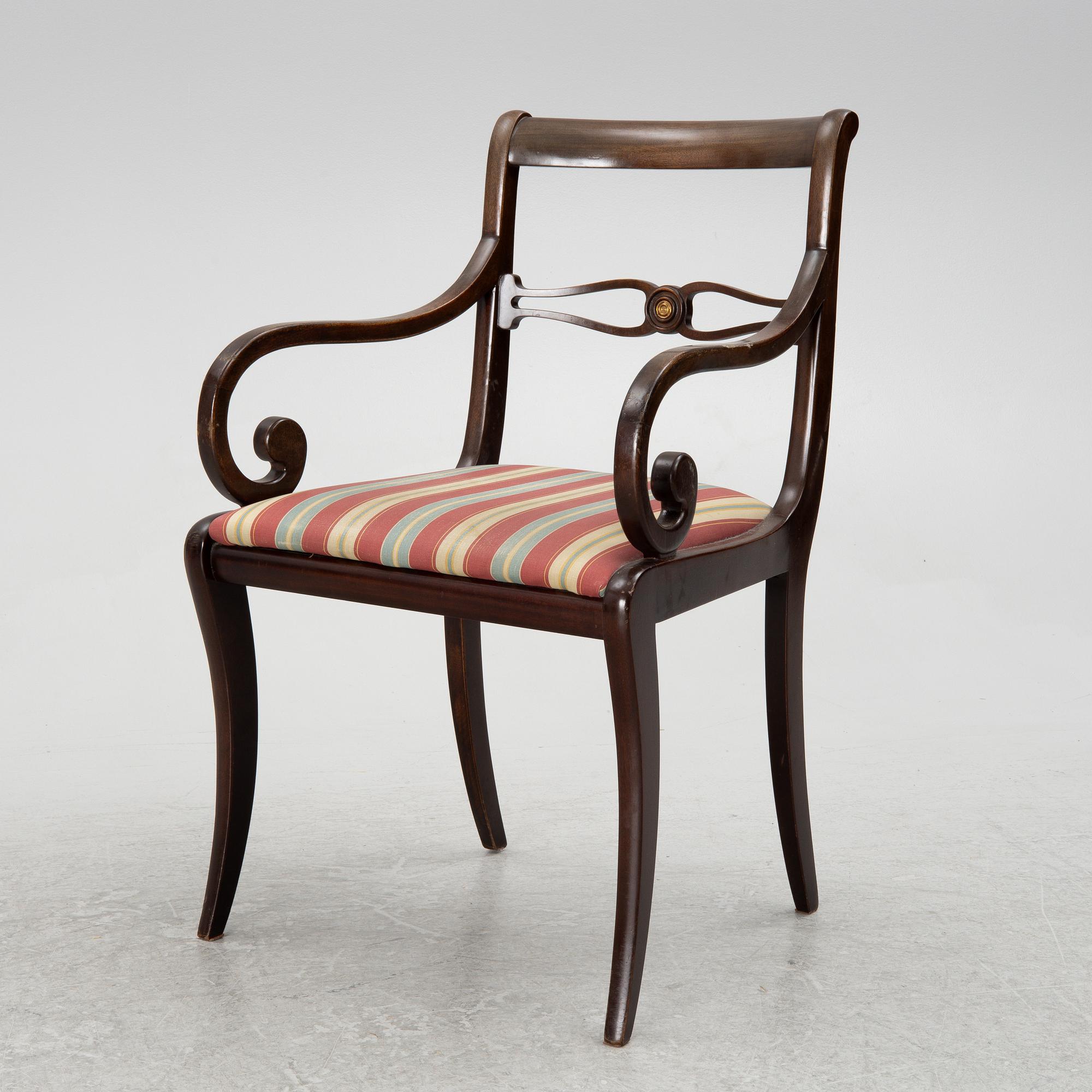 A mahogany veneer desk with desk chair, 20th Century.
