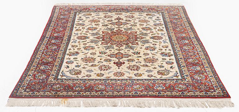 A semi-antique Isfahan rug, c. 225 x 143 cm.