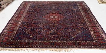 An oriental carpet, c. 360 x 270 cm.