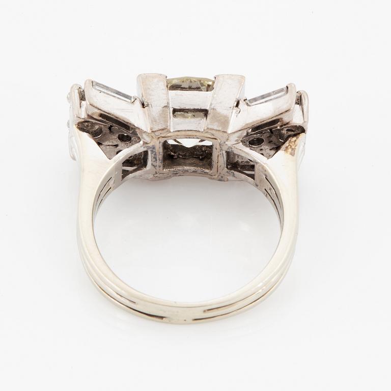 A baguette cut and old brilliant cut diamond ring.