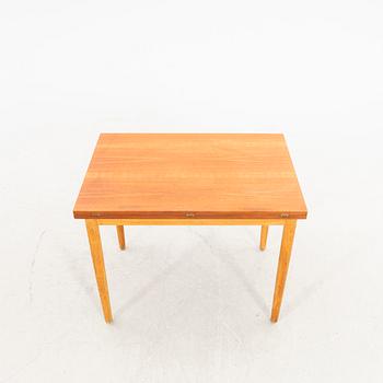 A 1960s oak and teak dining table.
