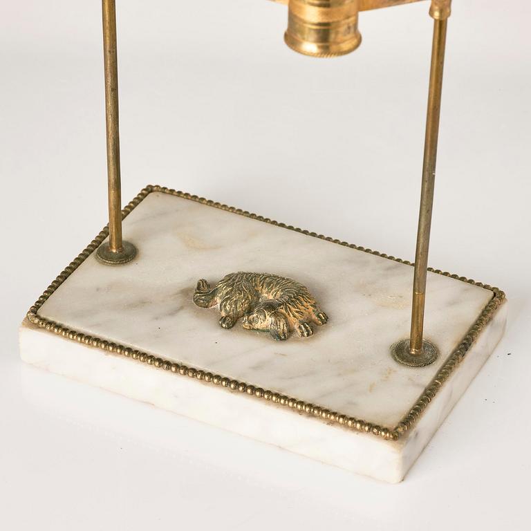 A Gusttavian gilt brass, white marble and tole two-light reading lamp, late 18th century.