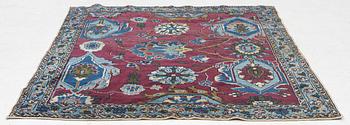 An antique rug, north-west Persian, so-called Vaghire, approx. 136 x 134 cm.