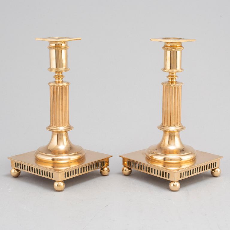 A pair of model 38 brass candlesticks from Gusums Bruk, first half of the 20th century.
