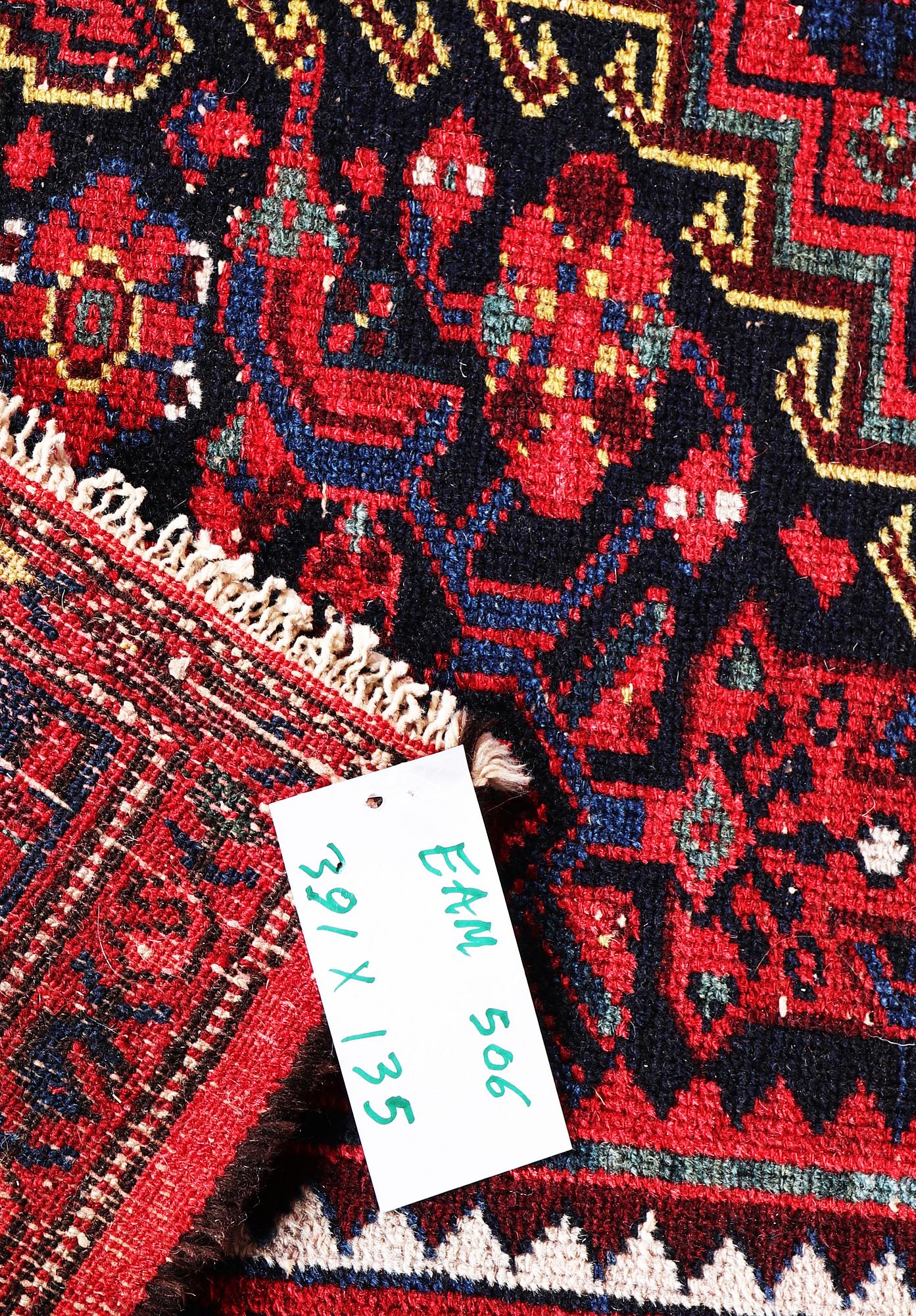 A Hosseinabad carpet, c. 391 x 135 cm.