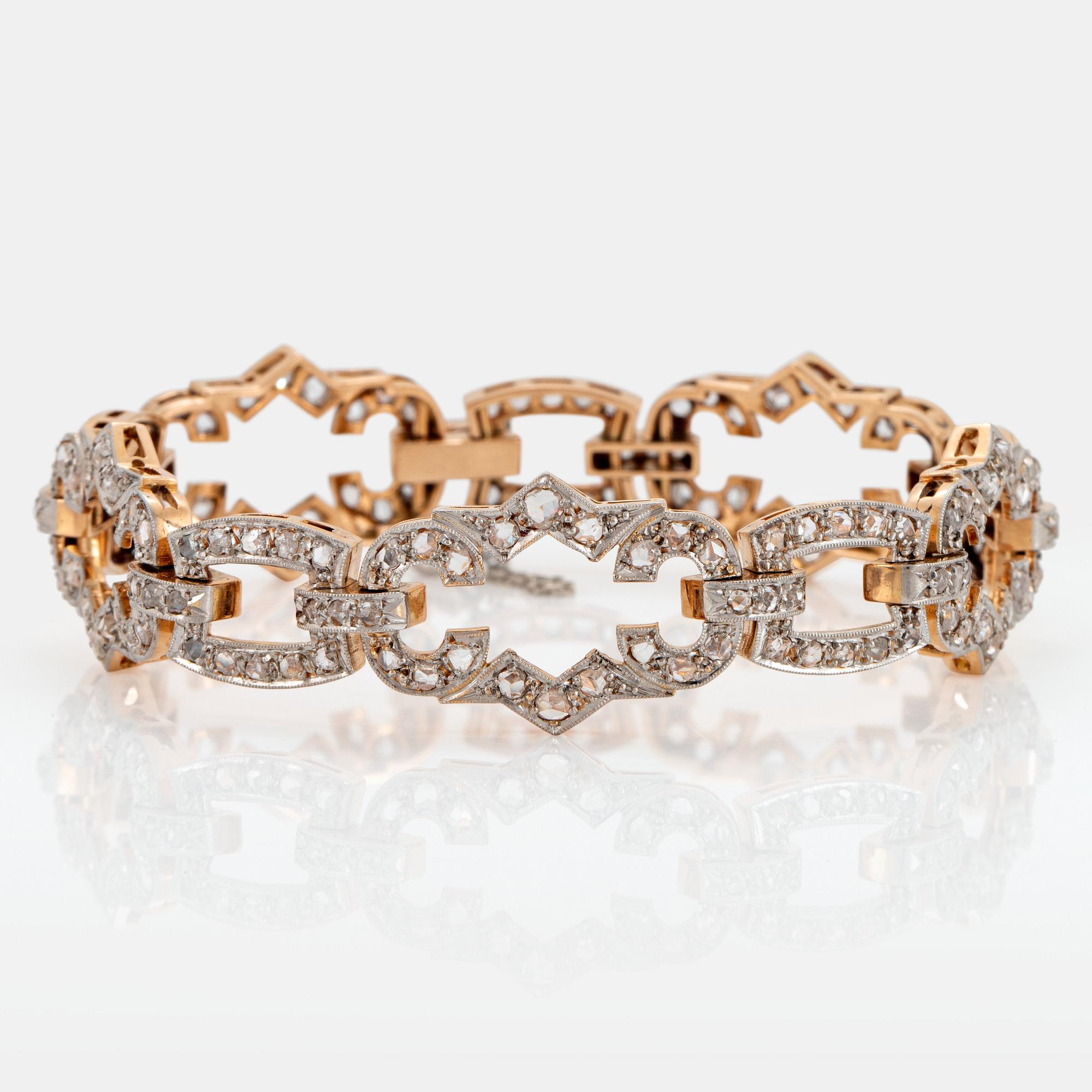 A 14K gold and platinum bracelet set with rose-cut diamonds.