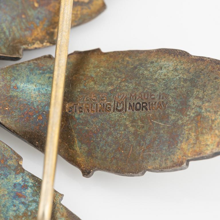 Two silver and enamel brooches, one by David Andersen, Norway.