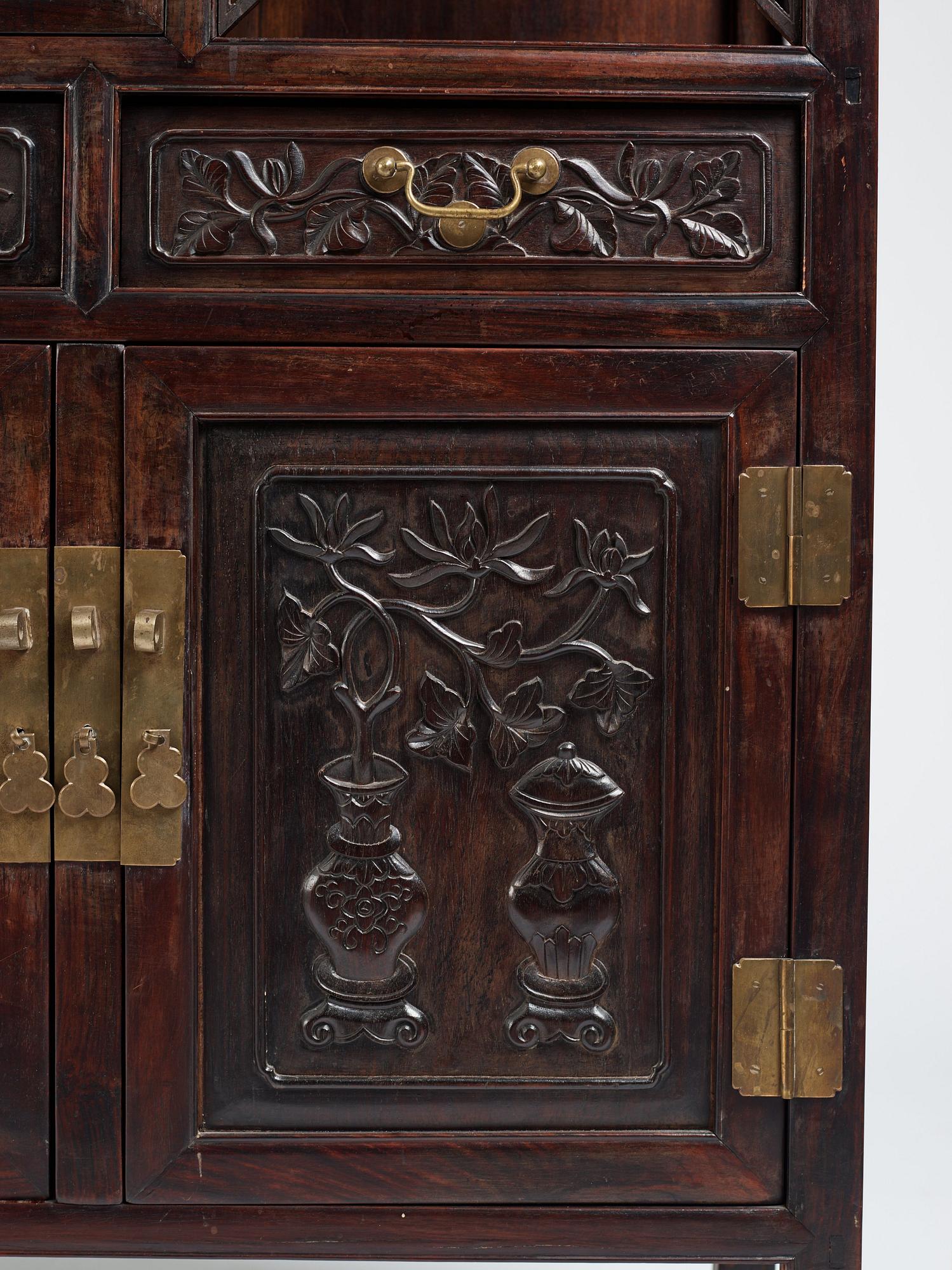 A pair of Chinese hardwood display cabinets, Qing dynasty, 19th Century.