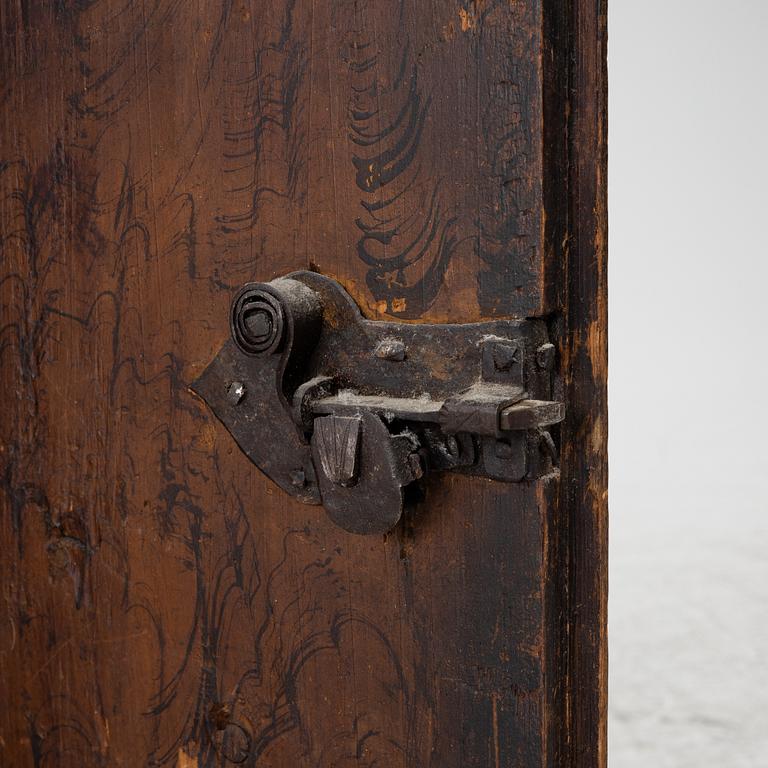 A corner cabinet, 18th Century.