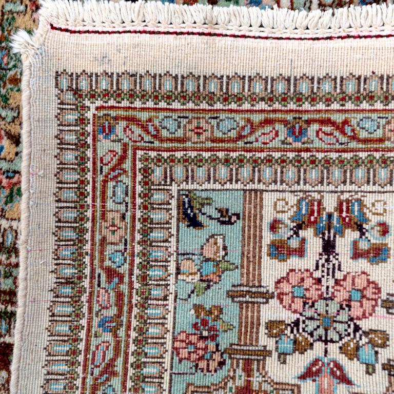 A semiantique signed Tabris carpet ca 364x262 cm.