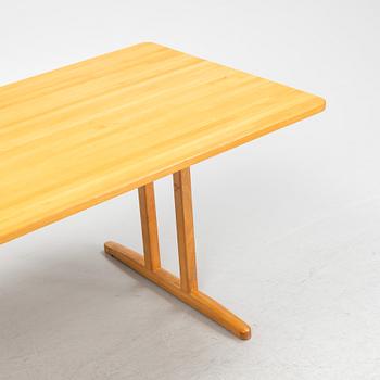 A beech dining table, second half of the 20th Century.