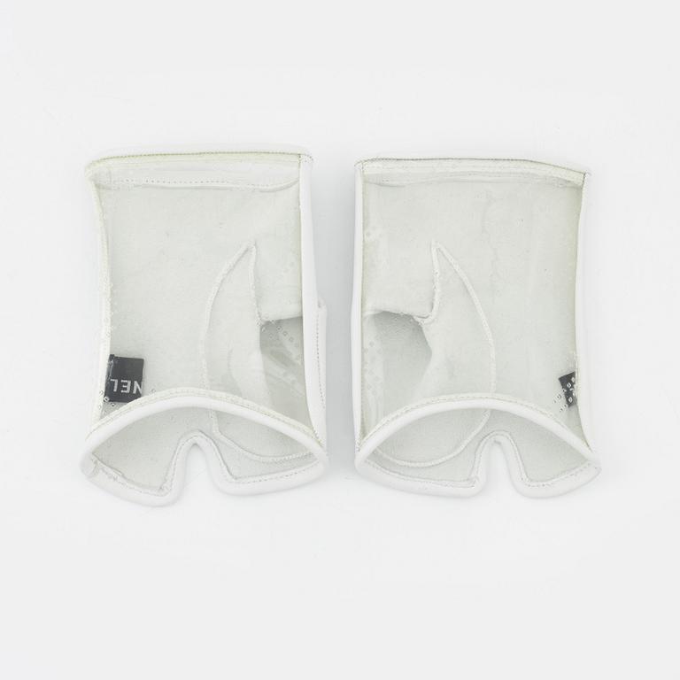 Chanel, a pair of polyurethane and lambskin gloves, size 7.