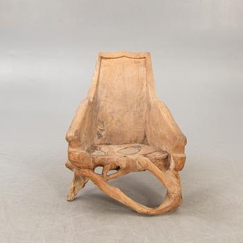 A late 20th century wooden armchair.