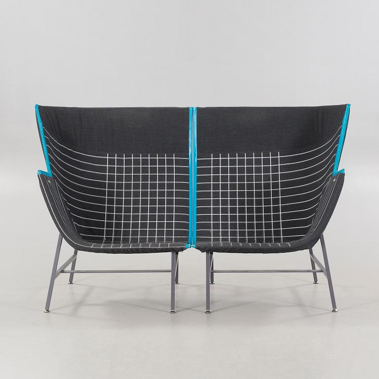 A pair of 21st century "Paper Planes" armchairs by Nipa Doshi and Jonathan Levien for Moroso.