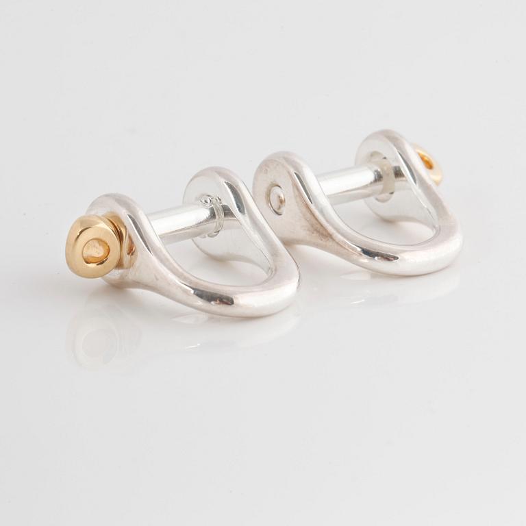 A pair of cufflinks by Ole Lynggaard.