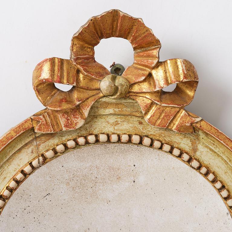 A pair of Gustaviantwo-branch giltwood girandole mirrors by C. G. Fyrwald (master in Stockholm 1776-1825).
