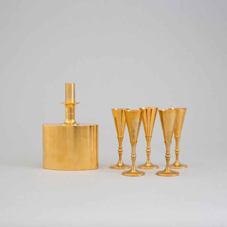 A gilt brass bottle and five glasses from Skultuna, 1989-96.