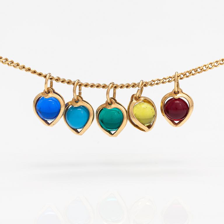 A 14K gold neckalce with glass pearls.