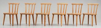 Axel Einar Hjorth, a set of six "Utö" stained pine chairs, Nordiska Kompaniet, Sweden 1930's.