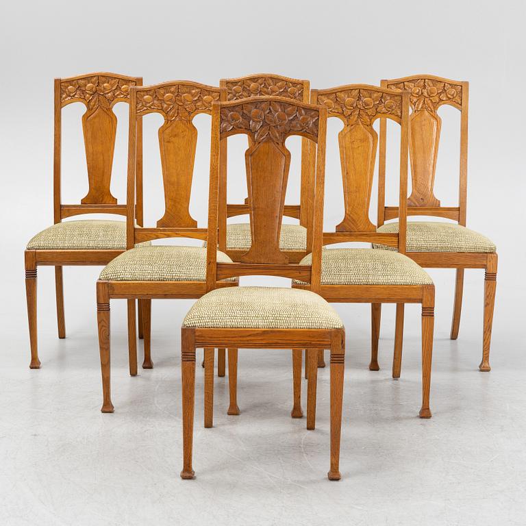 A set of six oak chairs, around the year 1900.