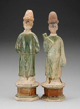 Two green and yellow glazed potted figures of Dignitaries, Ming dynasty.