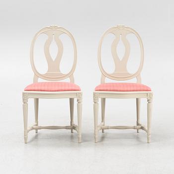 A Gustavian style table with four chairs, second half of the 20th century.