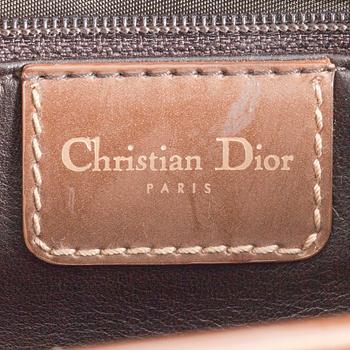 CHRISTIAN DIOR, a gold toned leather handbag, "Saddle bag".