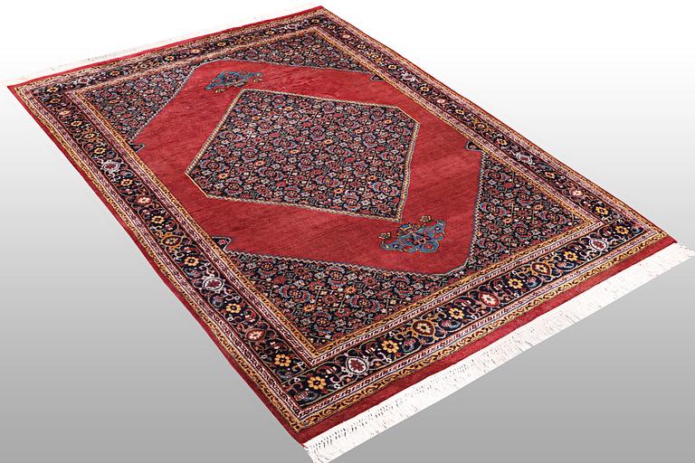 A rug, Tabriz, ca 241 x 167 cm.