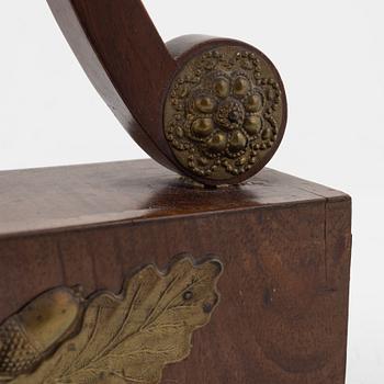 An Empire mantle clock from the 19th century.