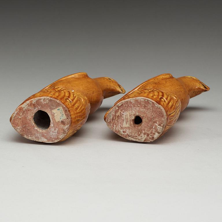 A pair of brown and yellow glazed figures of parrots, Qing dynasty, presumably 18th Century.