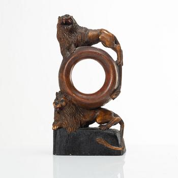 A carved pocket watch stand, Sweden, 19th century.