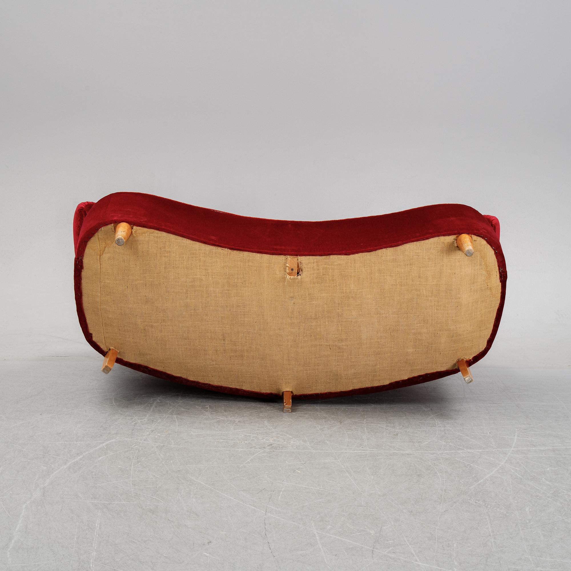 A first half of the 20th Century sofa with velvet upholstery.