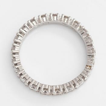 Cartier, a platinum and brilliant-cut diamond eternity ring.