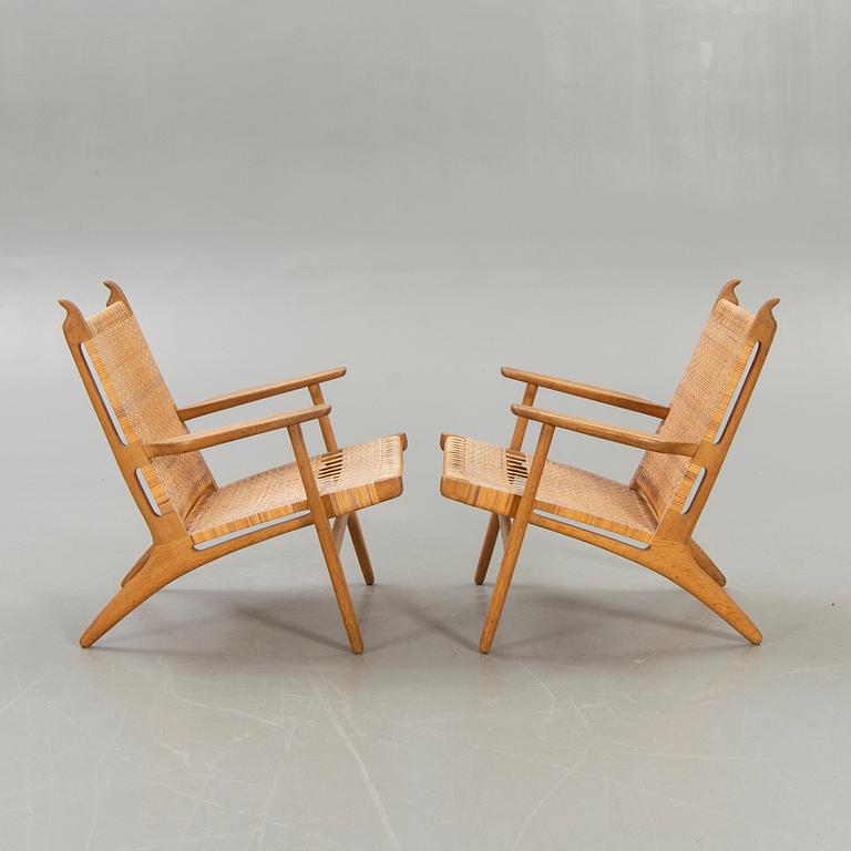 Hans J Wegner, a set of two CH27 oak and rattan armchairs.
