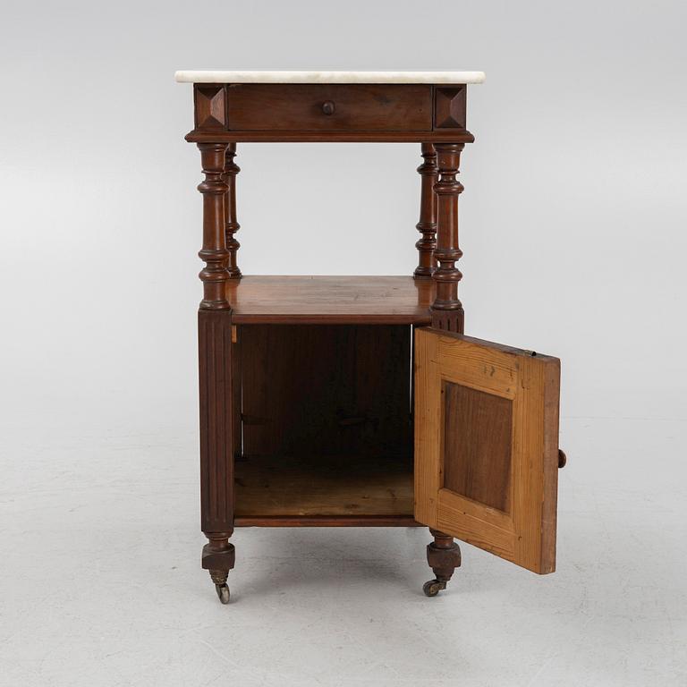 An early 20th century bedside table.