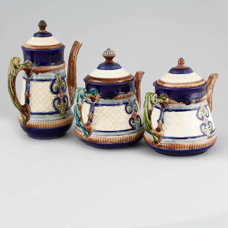 A majolica coffee pot and two tea pots from Gustavsberg, turn of the century 1900.