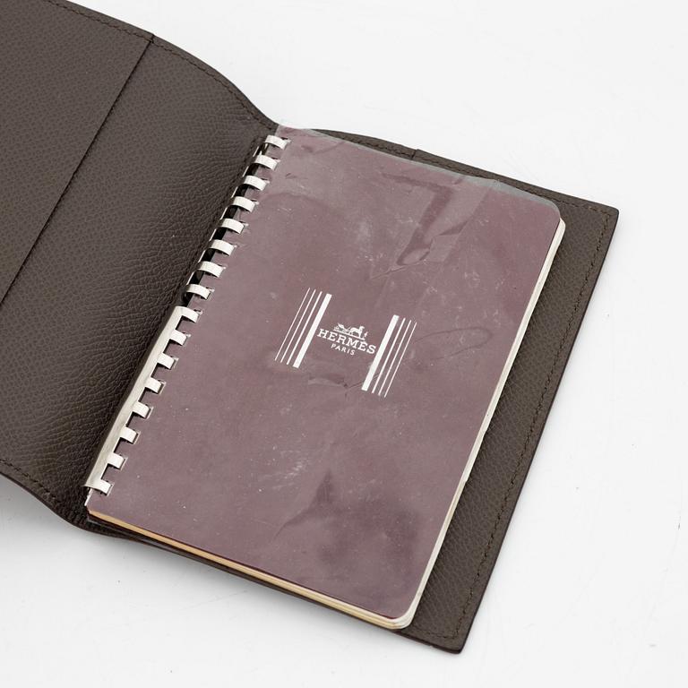 Hermès, notebook with leather case.