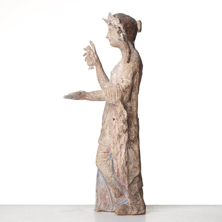 A Greek pottery sculpture of an elegant lady, Hellenistic, probably circa 300 B.C.