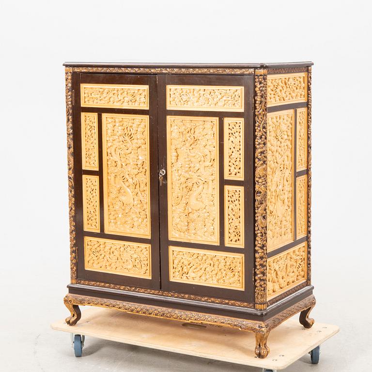 A Chinese wooden cabinet  mid 1900s.