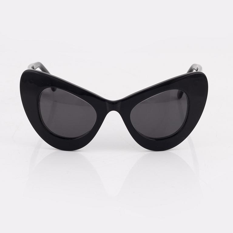 Illesteva, a pair of black "Zac posen x Illesteva" sunglasses.
