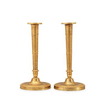 1626. A pair of French Empire early 19th century candlesticks.