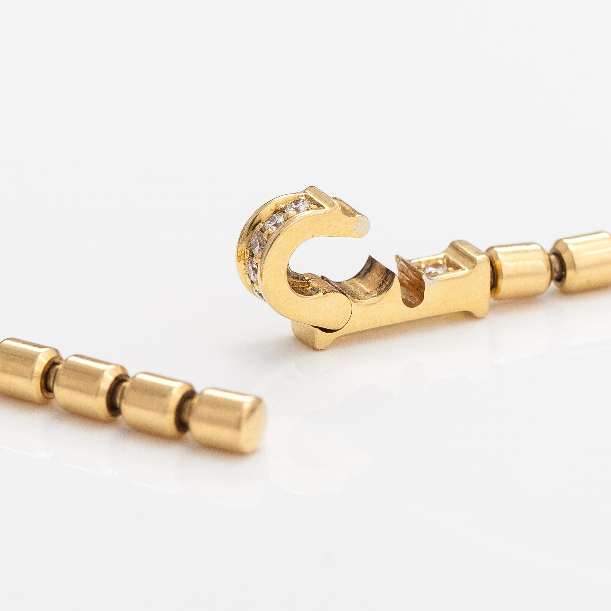 Piaget, An 18K gold "Possession" necklace with diamonds ca. 0.17 ct in total. Marked Piaget D18828.