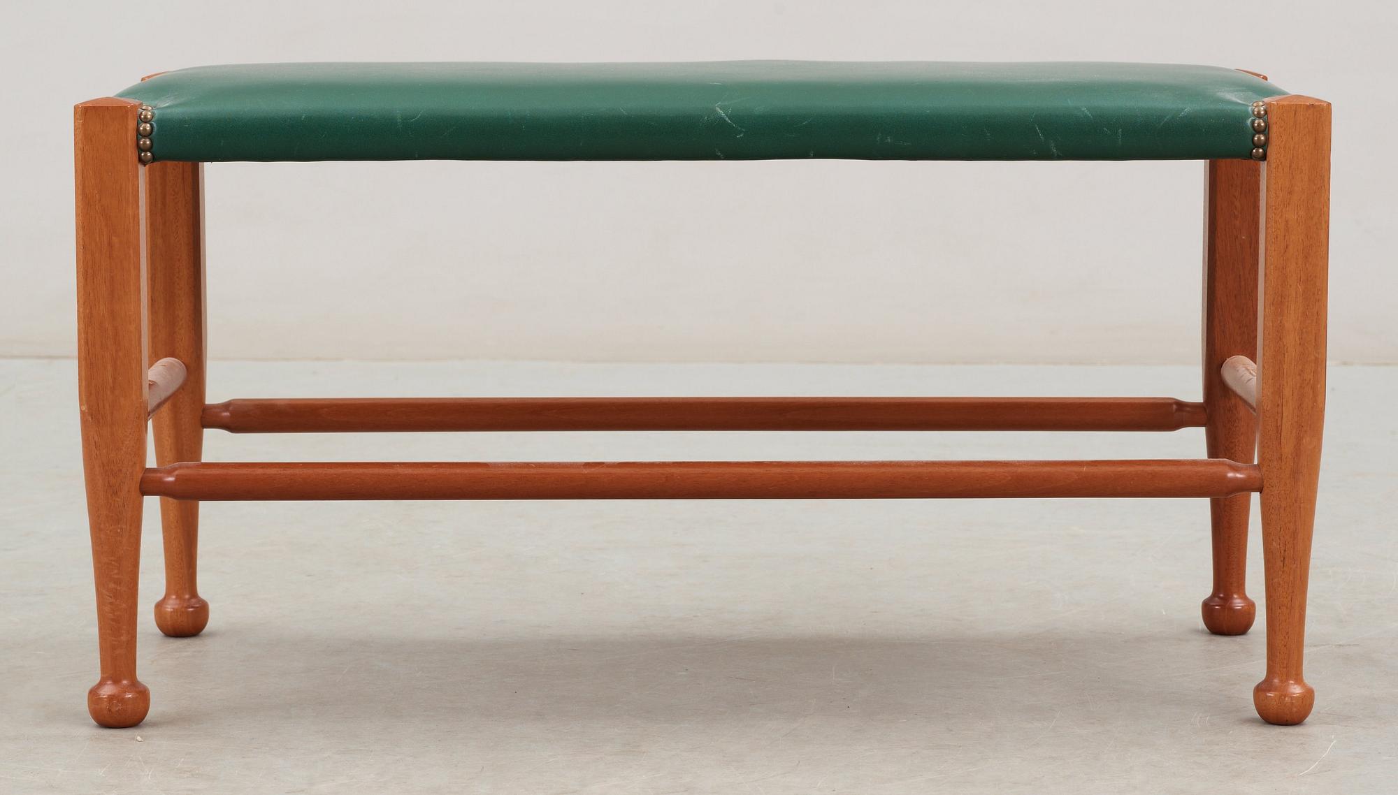 A Josef Frank mahogany and green leather bench, Svenskt Tenn, model 2009.