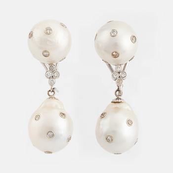 Cultured South sea pearl and brilliant cut diamond earrings.