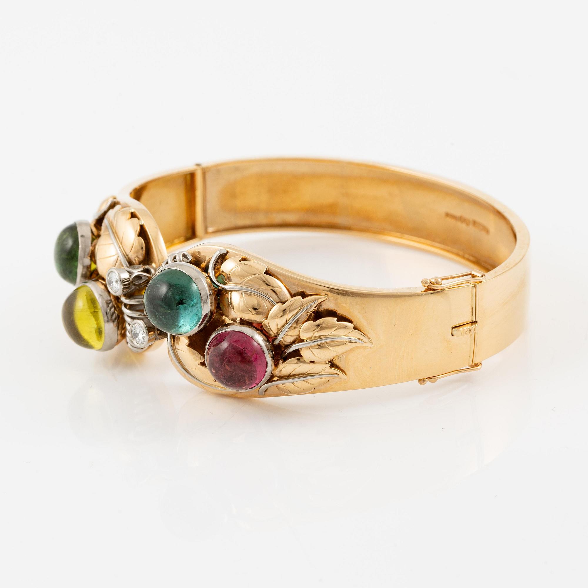 An 18K gold bracelet with cabochon-cut tourmalines.