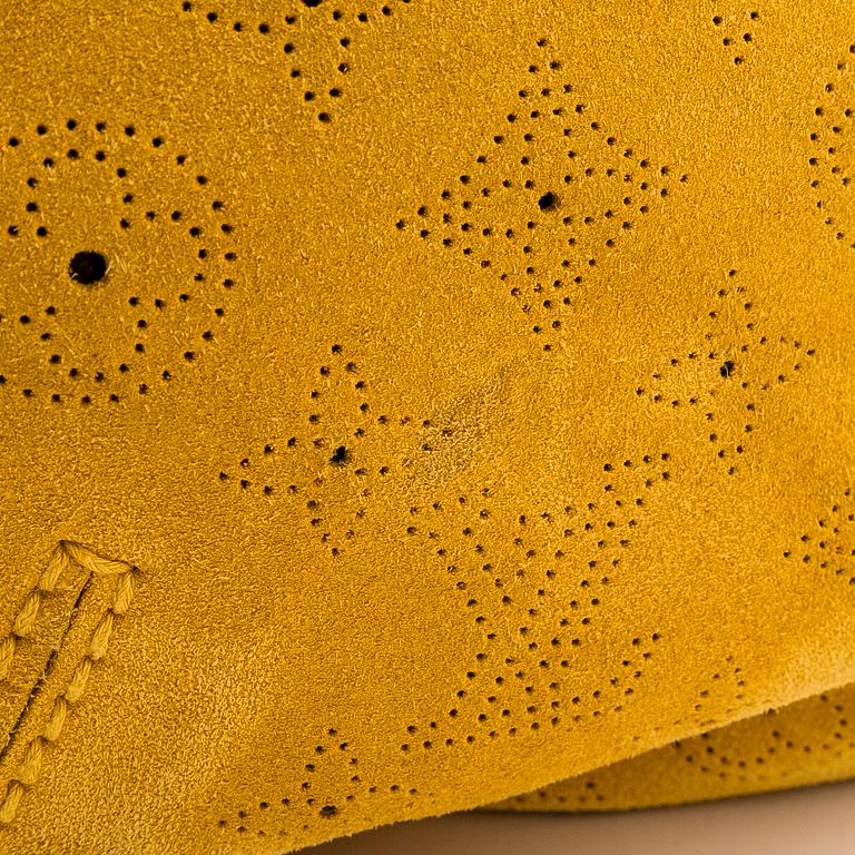 Louis Vuitton, an "Onatah GM" suede bag.