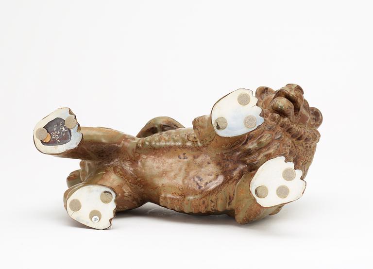 A Gunnar Nylund stoneware figure of a lion, Rörstrand.