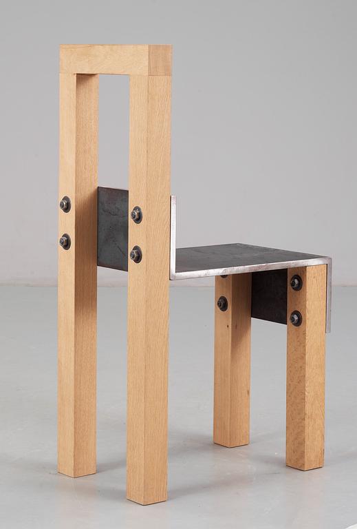 A Jonas Bohlin 'Sto' iron and oak chair, Stockholm 1990.