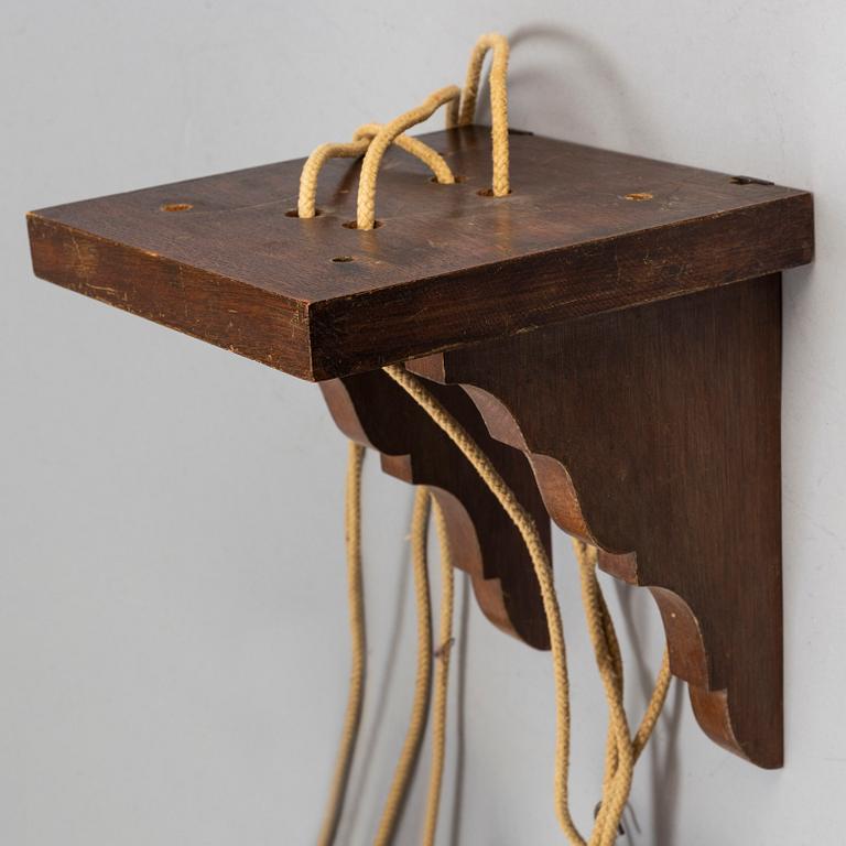 A late 17th or early 18th century lantern clock signed J Windmills London.